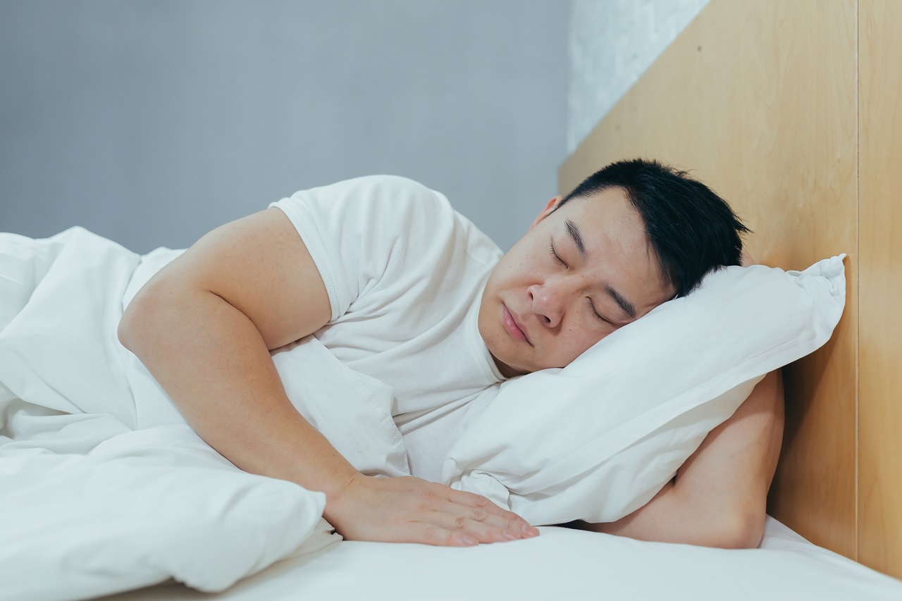 man sleeping on the bed